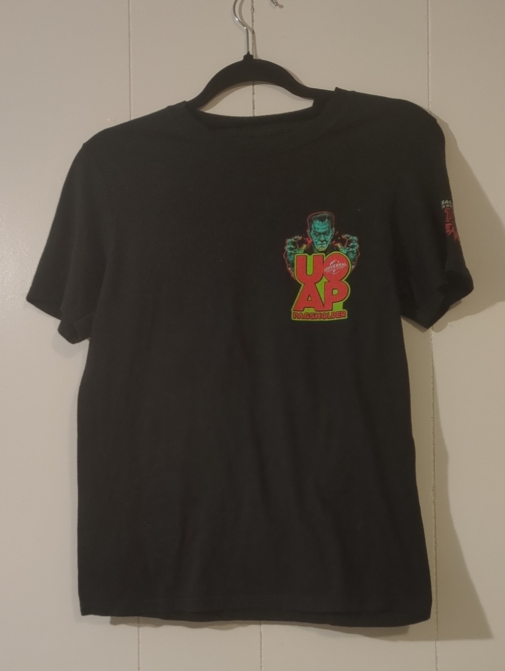 Universal Black Short-Sleeve HHN Anniversary Tee with Neon Green and Red Graphic